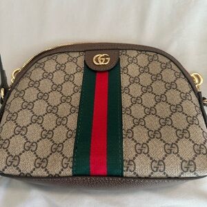 Cross body GG bag 9” wide 71/2” length, strap adjustable to  22”